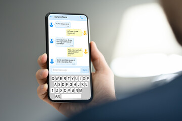 Hand Holding Cellphone Or Smartphone Texting