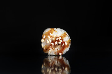 Sushi Rolls Set, maki, philadelphia and california rolls, on a Black background.