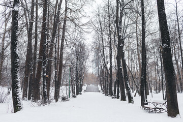 Russian winter, river bridge in the Park.Snow and ice on the road.