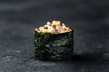 Sushi Rolls Set, maki, philadelphia and california rolls, on a Black background.