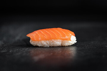 Sushi Rolls Set, maki, philadelphia and california rolls, on a Black background.