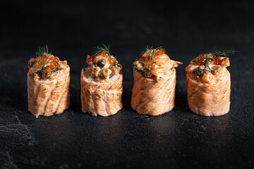 Sushi Rolls Set, maki, philadelphia and california rolls, on a Black background.