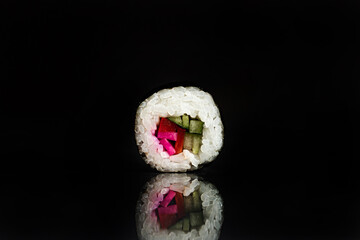Sushi Rolls Set, maki, philadelphia and california rolls, on a Black background.