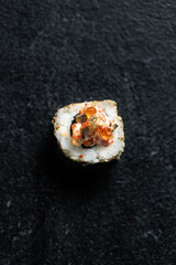 Sushi Rolls Set, maki, philadelphia and california rolls, on a Black background.