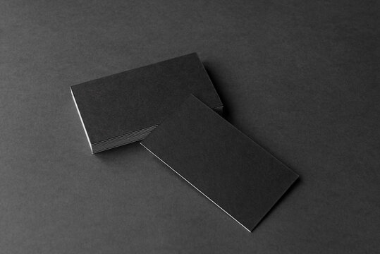 Business card on black background. Copy space for text.