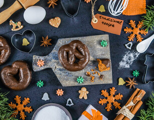 gingerbread and ingredients.

Gingerbread on a blackboard and ingredients around on a black...