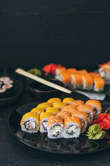 Sushi with salmon, cream cheese Philadelphia, cucumber and wasabi