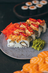 Sushi with salmon, cream cheese Philadelphia, cucumber and wasabi