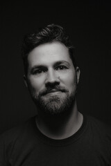Portrait of european male with happy face on black and white