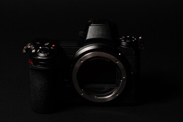 Mirrorless camera with large mount and sensor stabilization, front view.