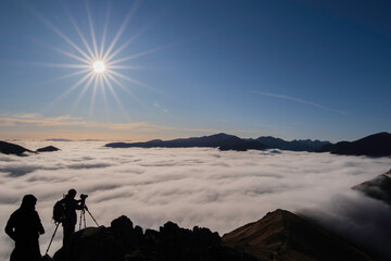 Photographers over the clouds -temperature inversion