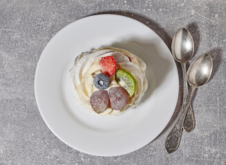 Pavlova cake on white plate