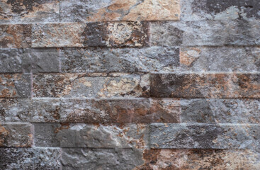 Natural facade stone decoration quartzite background texture. modern granite stone wall