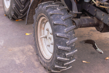 tractor wheel with suspension on asphalt