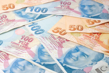 Stack of one fifty turkish lira bills and hundred turkish lira bills