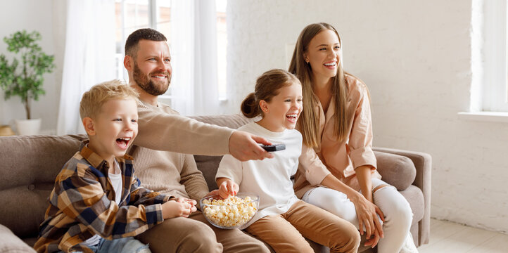 Happy Family Watching Comedy Together.