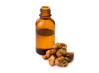 Sweet Myrrh Gum Resin Essential Oil in a Bottle (Opoponax) Isolated on White Background.