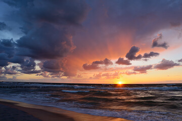 Naklejka na ściany i meble Sunset on the beach, Poland, Baltic sea/