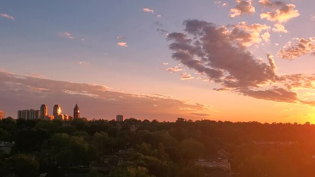 Panoramic time-lapse of Toronto sky and upscale Eglinton and Forest Hill residential area coveted by middle and upper class families as well as Ontario developers