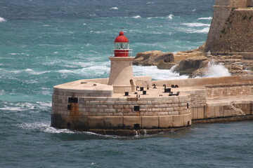 red lighthouse in the sea