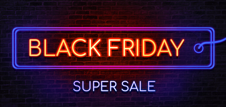 Black Friday sale neon sign. Brick wall as a background. Seasonal sale, shopping and store concept.