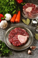 Raw beef shank with vegetables and garlic.