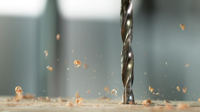 Super slow motion of detail of a drill bit drilling into wood. Filmed on high speed cinema camera, 1000 fps.