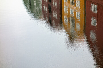 reflection of street houses in water
