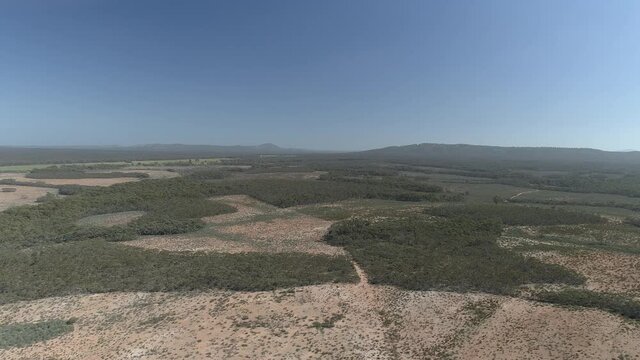 Inglewood Aerial Landscape. Historic gold mining part of the golden triangle. Mountain range landscape, goldfields with state forest and green trees. Aerial view. DLog - RAW &ndash; Flying forward.