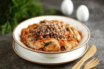 Stewed chicken with onions, carrots, tomato sauce and buckwheat.