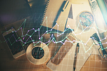 Double exposure of forex graph drawing and work table top veiw. Concept of financial analysis.