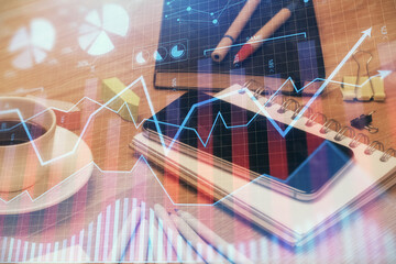 Double exposure of forex chart drawing and cell phone background. Concept of financial trading