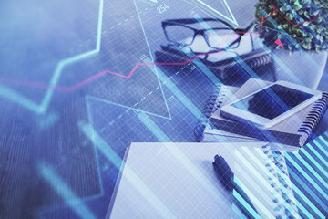 Double exposure of forex chart drawing and cell phone background. Concept of financial trading