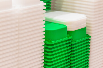 plastic boxes white and green are stacked