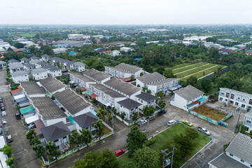 Obraz premium Aerial View drone camera of Houses Residential in Thailand Drone Above View Summer Blue Sky Estate Agent High angle view.