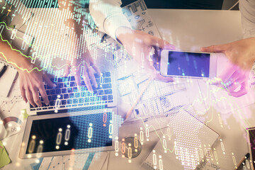 Multi exposure of man and woman working together and forex graph hologram drawing. Financial analysis concept. Computer background. Top View.