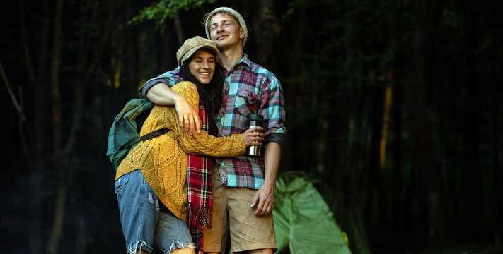 Shot Of A Happy Couple Camping On The Nature