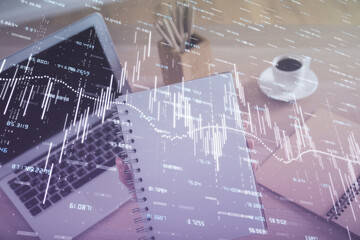 Double exposure of businesswoman hands typing on computer and forex chart hologram drawing. Financial analysis concept.