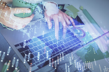 Double exposure of woman hands typing on computer and forex chart hologram drawing. Stock market invest concept.