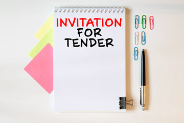 Blank sheet, pen and crumpled paper balls on grey table, flat lay. Text INVITATION FOR TENDER.