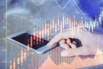 Double exposure of forex chart sketch hologram and woman holding and using a mobile device. Financial market concept.