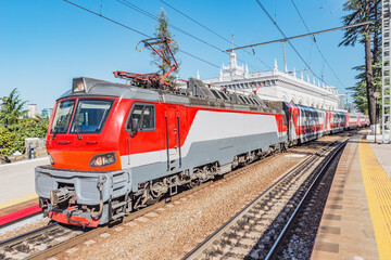 Fototapeta na wymiar Passenger train is ready to depart from the main railway station. Sochi.