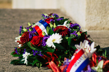 Closeup of wreath of flowers at the Armistice commemoration ceremony during the coronavirus epidemic and the lockdown to impose containment of the population