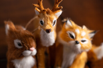 Obraz premium Reindeer fox and squirrel furry stuffed animals shot with macro lens