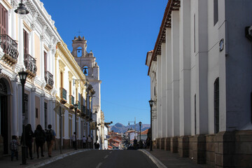 view of classic colonial street with white walls at sucre white city in bolivia