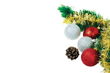 Close up view of Christmas fir tree branch with  cone and colorful balls isolated on white background.  Postcard. Christmas and New Year holidays concept background.