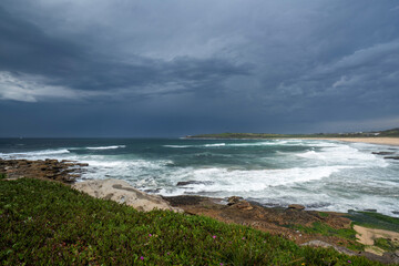 Fototapeta na wymiar Storm clouds over the popular surf beach called Maroubra Beach
