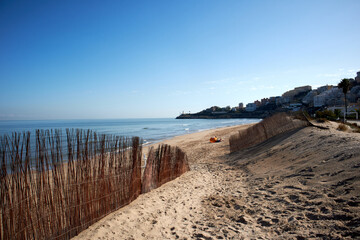 Fototapeta na wymiar CULLERA, SPAIN - 2020: Dunes on Cullera Beach