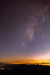 Obraz na płótnie Canvas Amazing galaxy with the milky way and golden bright light before sunset,