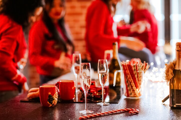 two glasses of champagne on a Christmas kitchen island